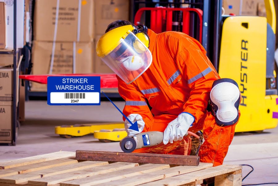 Tool Tracking Labels. Warehouse worker using tool with label on it