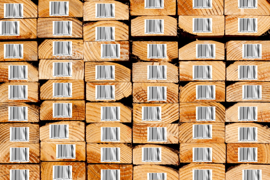 RevealPro. Stack of 2x4 lumber boards with printed barcode tags on the end or each of each board